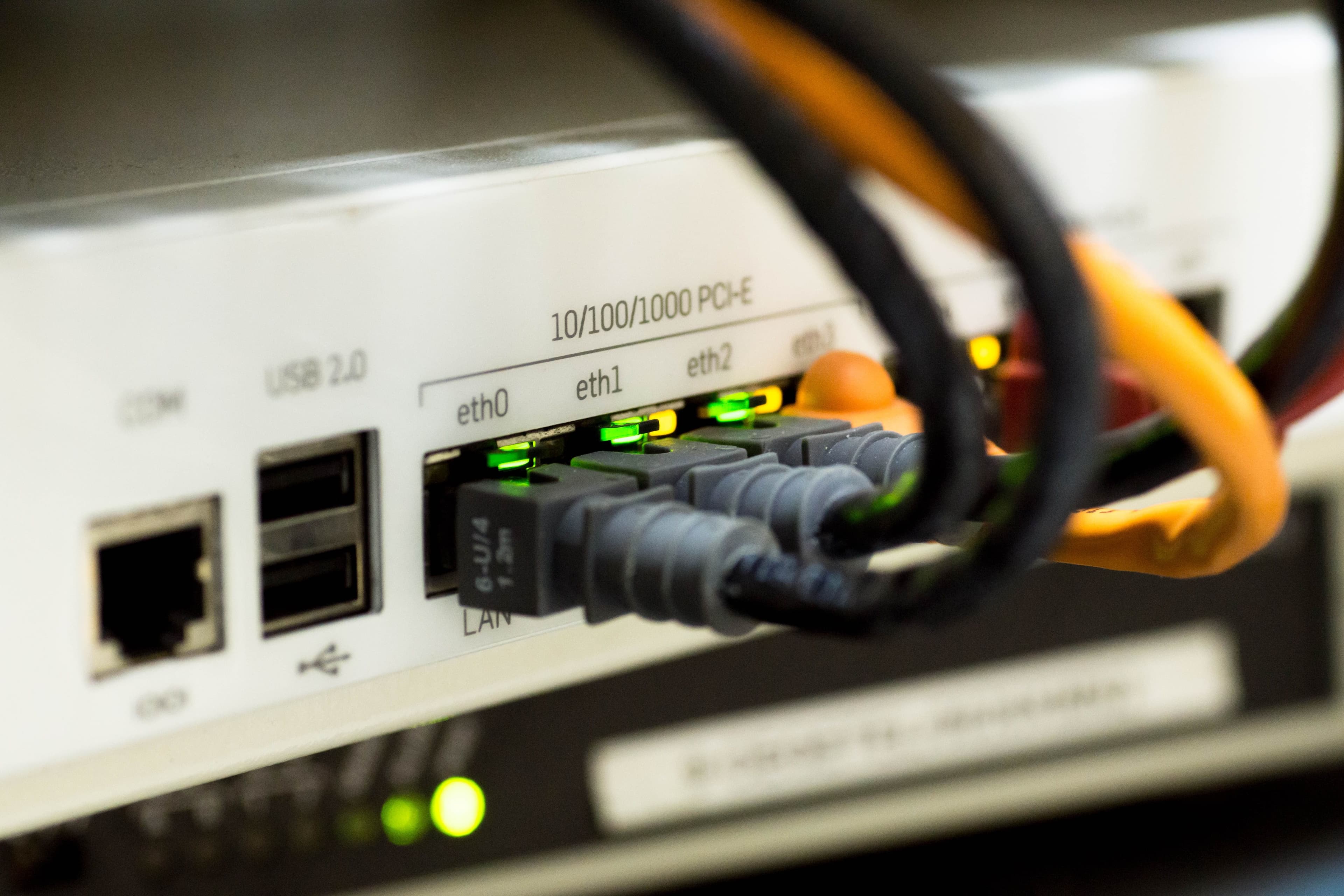 Network cables and router dashboard displaying IPTV performance metrics