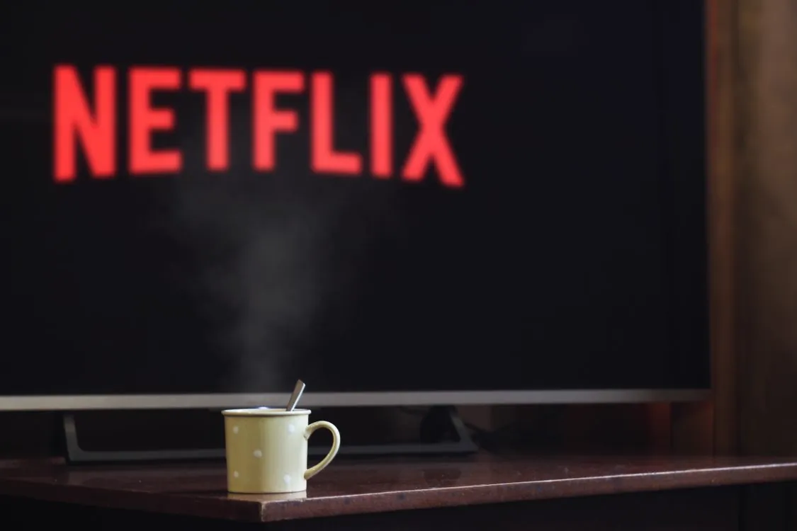 Apple TV screen displaying Netflix streaming interface, demonstrating the content available through IPTV streaming services on tvOS