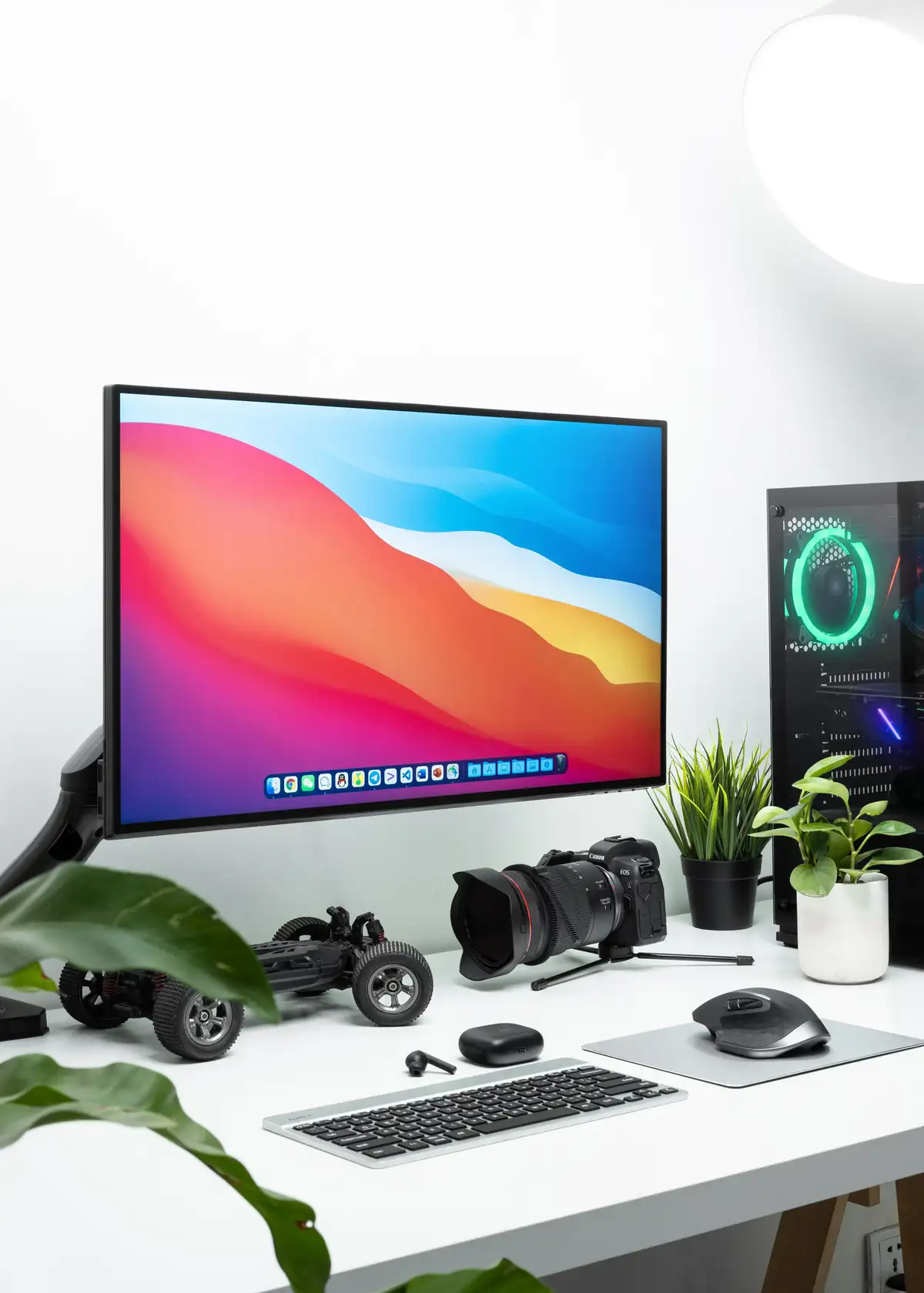 Modern desk setup with a flat screen display and audio equipment, reflecting the reliable and stable media player environment of GSE SMART IPTV on Apple TV